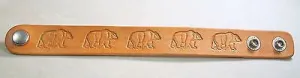 A Bear image hand stamped and stained leather bracelet adjustable.