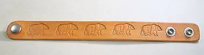 A Bear image hand stamped and stained leather bracelet adjustable.
