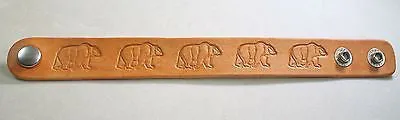 A Bear image hand stamped and stained leather bracelet adjustable.