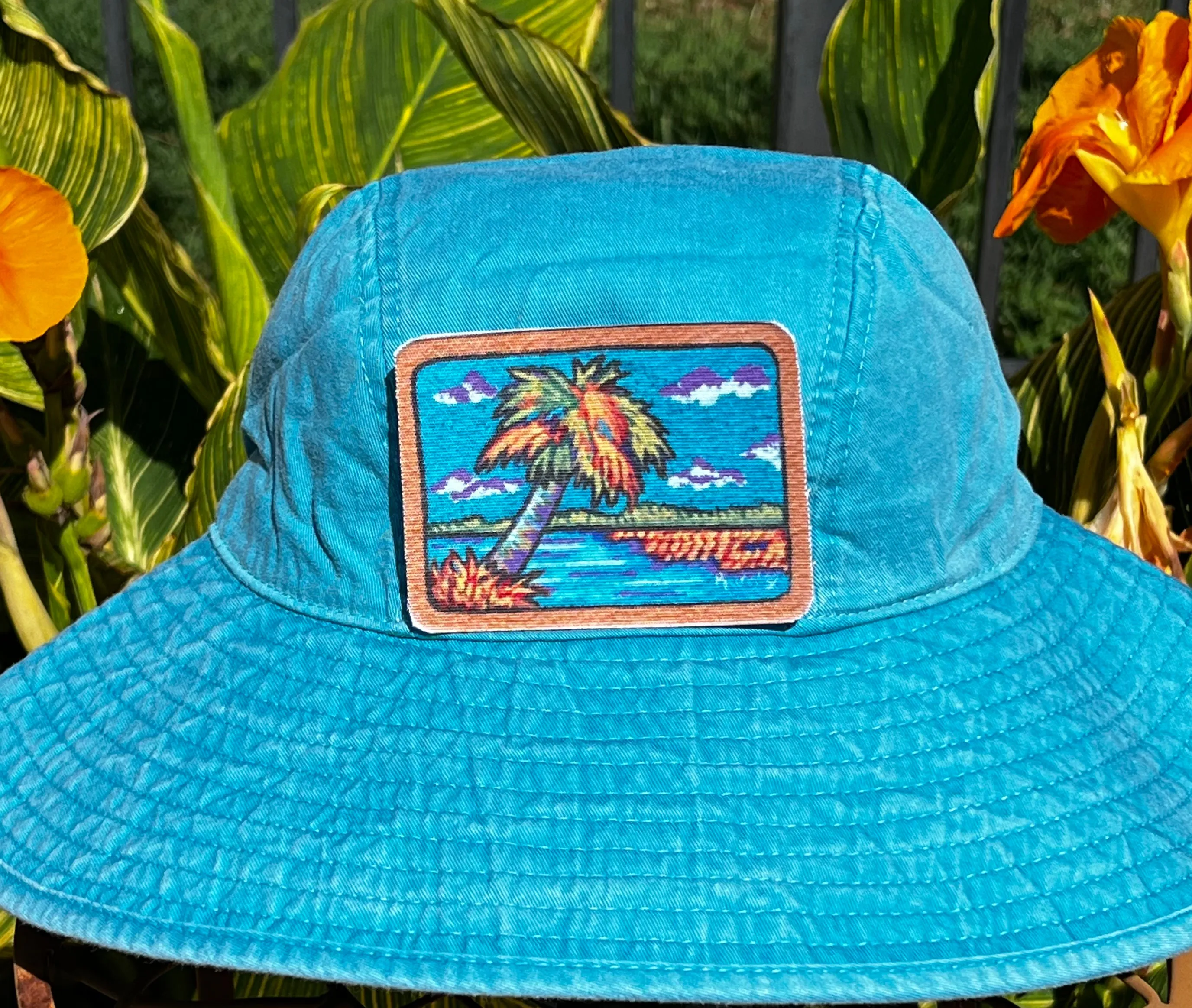 Rural Heart®️ by René Earnhardt “Palm Tree” bucket hat featuring original art