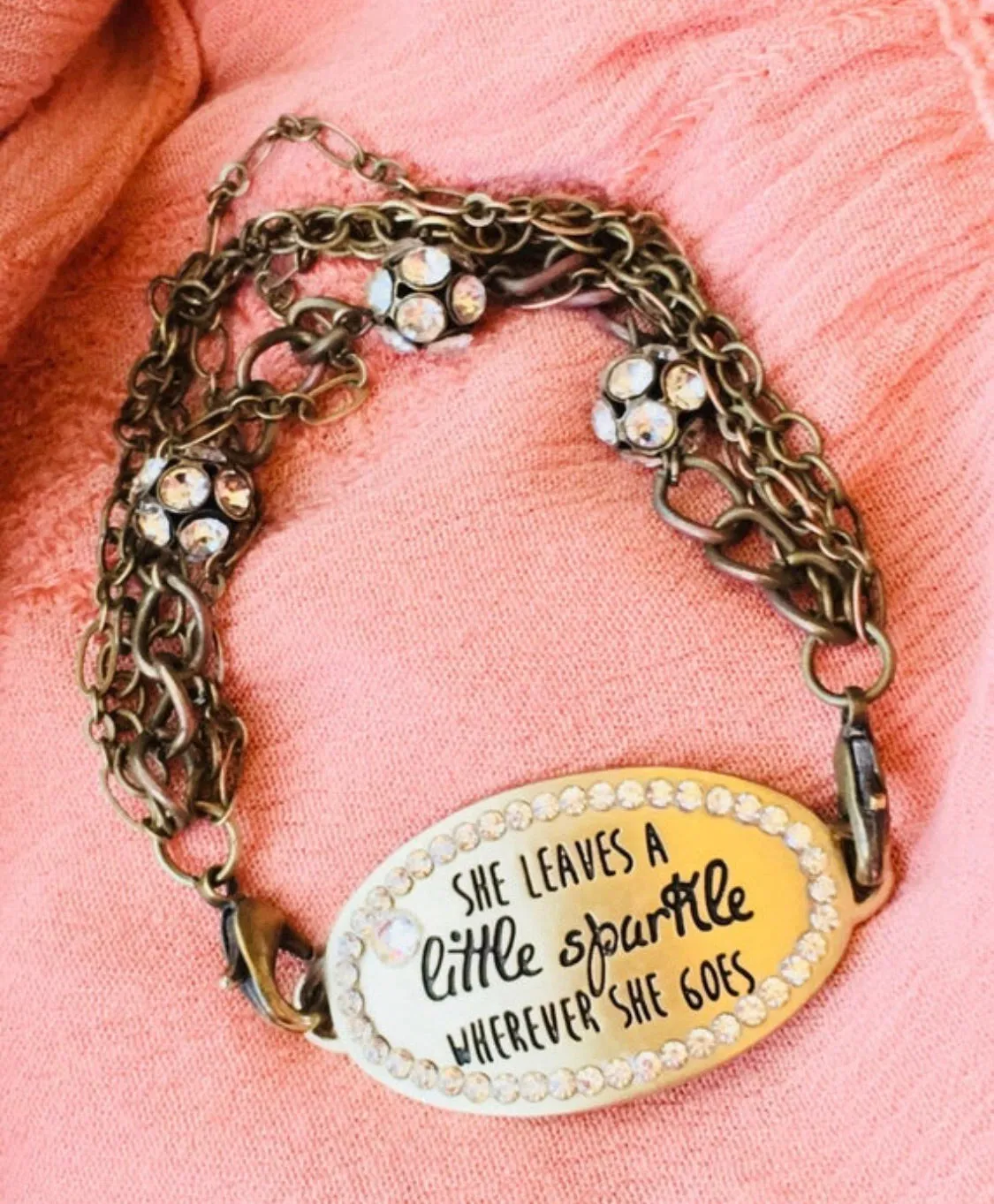 She leaves a little sparkle wherever she goes. Bracelet. Leather wrap or gold chain. Charms.