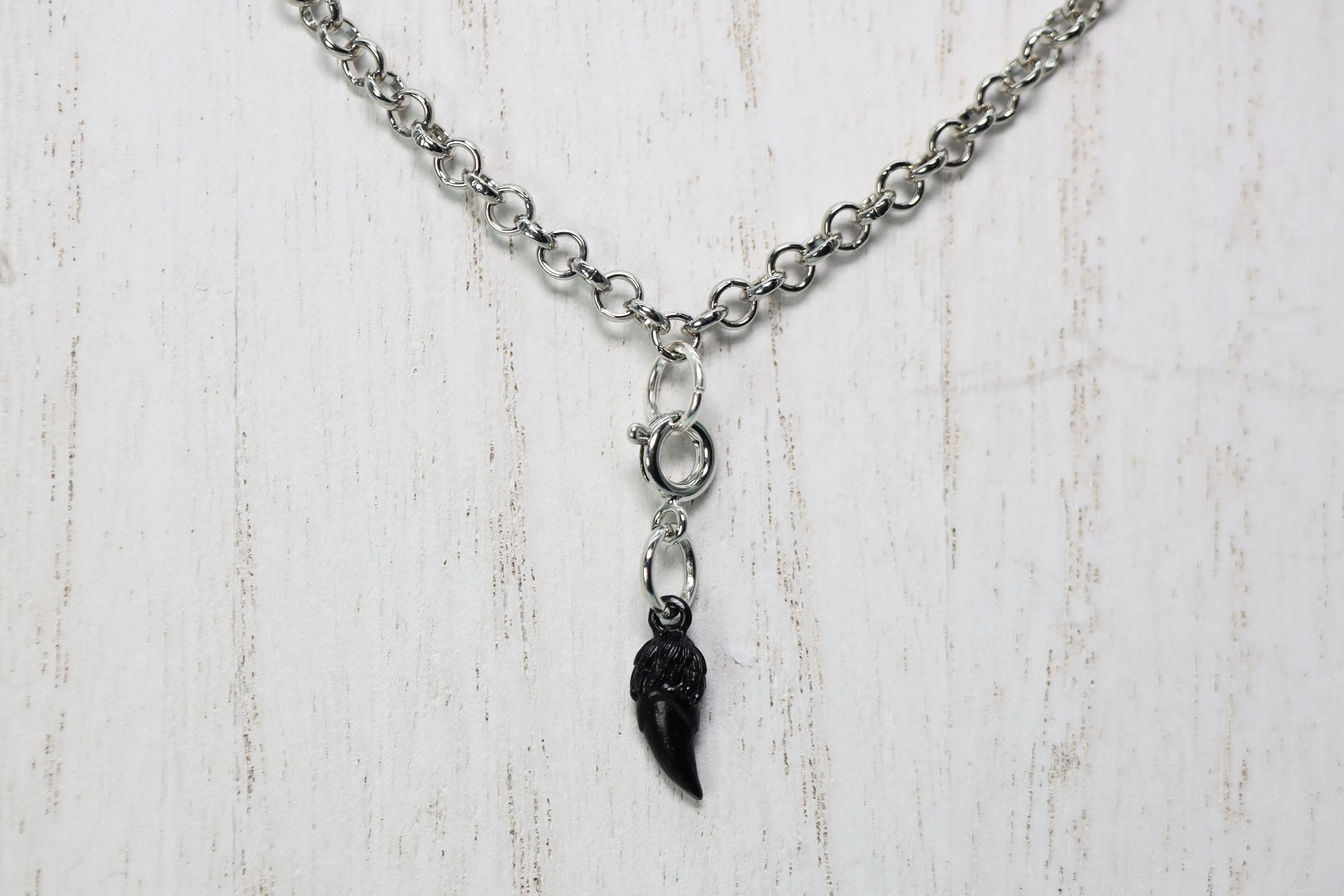 Traveler's Trinkets: Dragon Fang Charm
